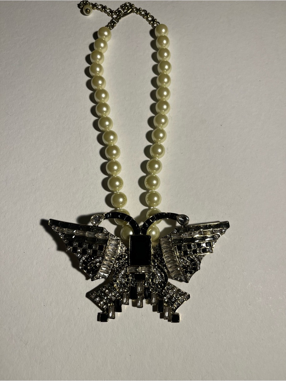 Heidi Daus Pearl Necklace with Crystal 
Monarch Black Butterfly Pendant